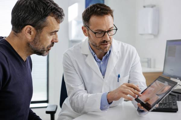 Learn what dark spots, redness, white patches, and other genital skin color changes can mean in men, including irritation, STIs, balanitis, lichen sclerosus, and warning signs that need medical care.