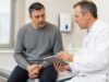 Learn how lichen sclerosus in men causes white patches, foreskin tightness, painful cracks, urinary symptoms, and what treatments can help.